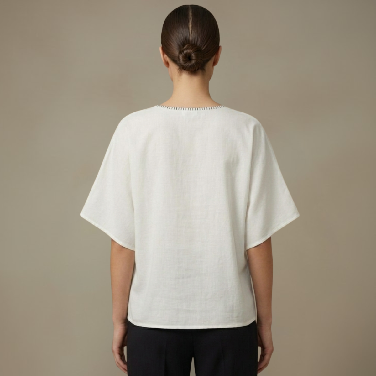 Women wearing a white Mangalagiri Cotton top with a neutral background by Almitra Tattva