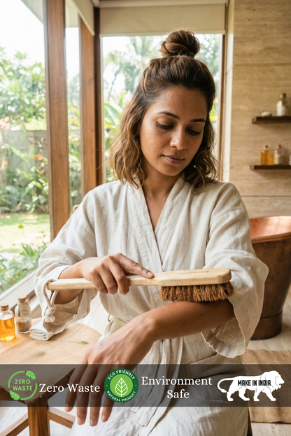 Woman in a white robe using a Almitra Sustainables - Natural Coconut Coir Long Handle Body Brush – Zero Waste Body Brush  in a zero waste setting