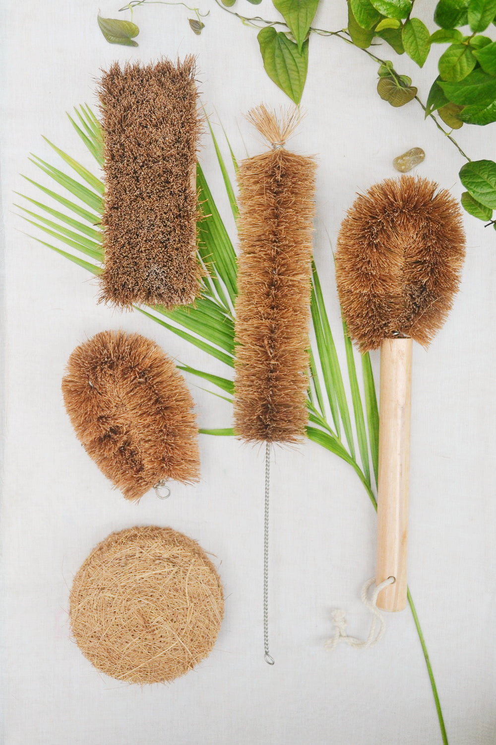 Eco-friendly coconut fibre cleaning brush set with wooden handles, ideal for sustainable home and kitchen use.